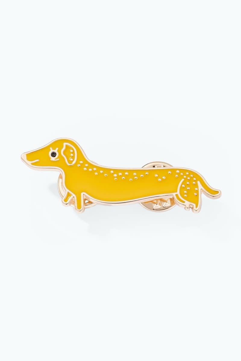 Yellow dachshund-shaped pin on a white background